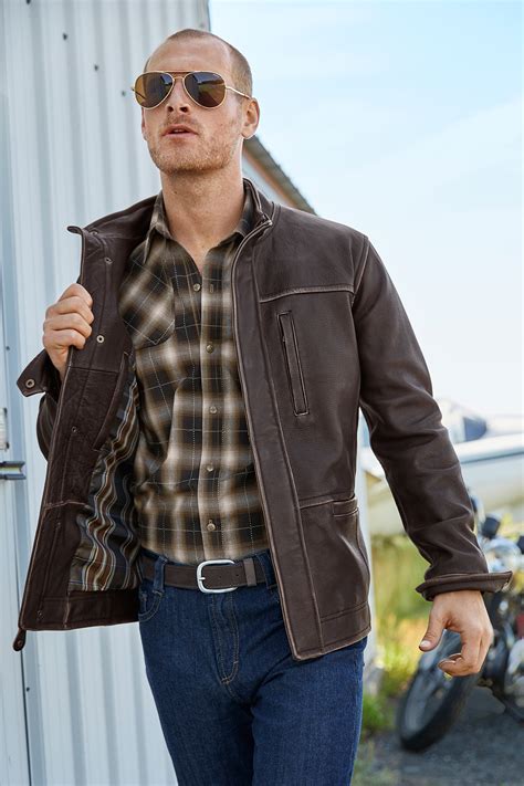 The territory ahead - Falcon Bluff Vers. 2 Leather Jacket. Our best-selling leather jacket gets a minor redesign. Now with side entry pockets, and new stitching detail at the shoulders. Investment quality burnished cowhide that gets better with age and wear. With an olive camouflage poly jacquard lining and six pockets (3 on the outside, 3 inside—two have zippers). 